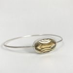 Polsera de plata amb detall ovalat daurat d’estil Art Déco