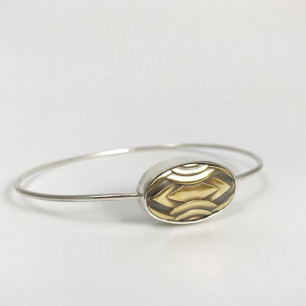 Bracelet en argent avec détail ovale doré de style Art Déco